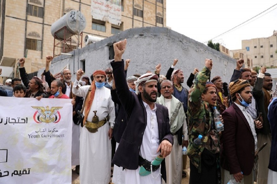 Houthis shout slogans as they gather outside the United Nations offices to denounce the Saudi-led coalition's blockade, in Sanaa, Yemen July 05, 2020 — Reuters