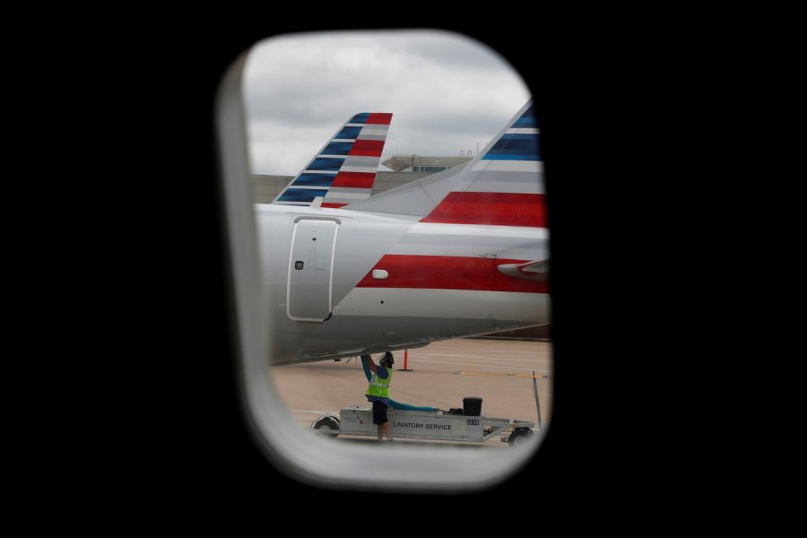 An airlines worker works on an American Airlines plane that arrived at Hartsfield–Jackson Atlanta International Airport, as the coronavirus disease (Covid-19) continues, in Atlanta, Georgia, US on May 19, 2020 — Reuters/Files
