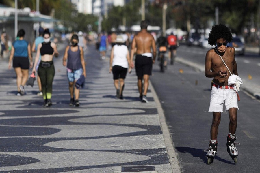 People are seen in Copacabana Beach amid the outbreak of the coronavirus disease (Covid-19) in Rio de Janeiro, Brazil, July 28, 2020 — Reuters