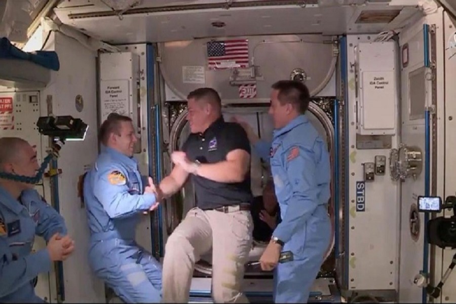 NASA astronaut Bob Behnken and Doug Hurley arrive at the International Space Station aboard SpaceX's Crew Dragon capsule in this still image taken from video, May 31, 2020 — NASA via Reuters