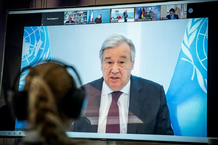 United Nations Secretary-General Antonio Guterres is seen on a video screen during a virtual climate summit, known as the Petersberg Climate Dialogue, in Berlin on April 28, 2020 — Reuters