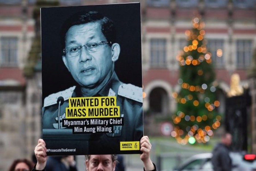 People demonstrate outside the International Court of Justice (ICJ), before the arrival of Myanmar's leader Aung San Suu Kyi for the second day of hearings in a case filed by Gambia against Myanmar alleging genocide against the minority Muslim Rohingya population, in The Hague, Netherlands December 11, 2019. Reuters