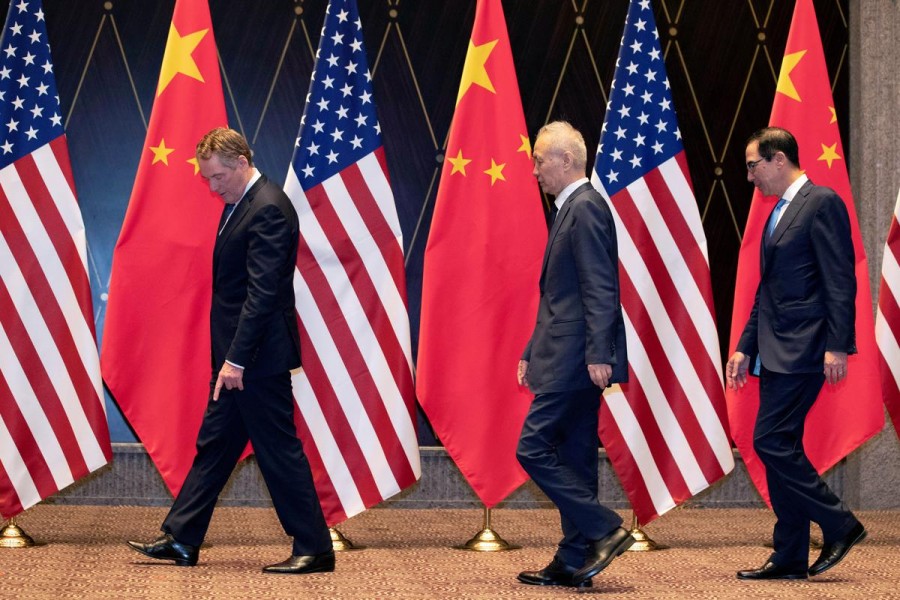 US Trade Representative Robert Lighthizer points at markers on the floor as he leads Chinese Vice Premier Liu He and Treasury Secretary Steven Mnuchin to their position for a family photo at the Xijiao Conference Center in Shanghai, China, July 31, 2019 — Reuters/Files