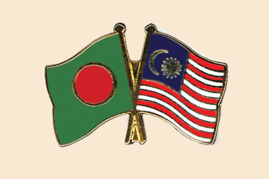 Flags of Bangladesh and Malaysia are seen cross-pinned in this photo symbolising friendship between the two nations