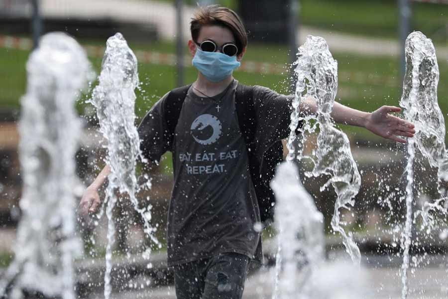 A boy wearing a protective face mask playing in a fountain after local authorities eased lockdown restrictions imposed to prevent the spread of the coronavirus disease (COVID-19), in Moscow of Russia in June –Reuters Photo