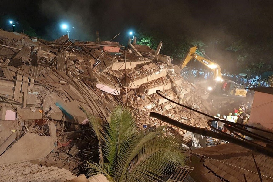 Rescue workers remove the debris as they look for survivors after a five-storey building collapsed in Mahad in Raigad district in Maharashtra, August 24, 2020 — Reuters