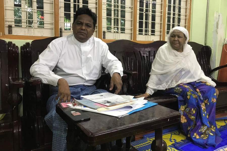 Rohingya candidate Abdul Rasheed sits next to his mother during an interview with Reuters at his home in Yangon, Myanmar, after his application to run as a candidate from Sittwe constituency was rejected with union election commission claiming his parents were not Myanmar citizens by the time he was born, August 22, 2020. REUTERS/Shoon Naing