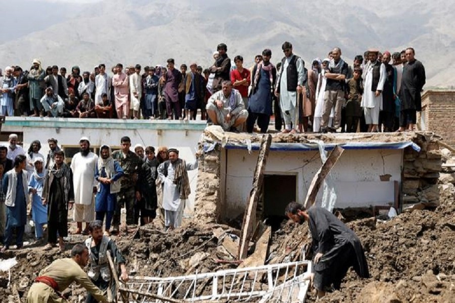 Relatives take part in a burial ceremony of two victims of Wednesday's floods in Charikar, capital of Parwan province, Afghanistan, August 27, 2020 — Reuters