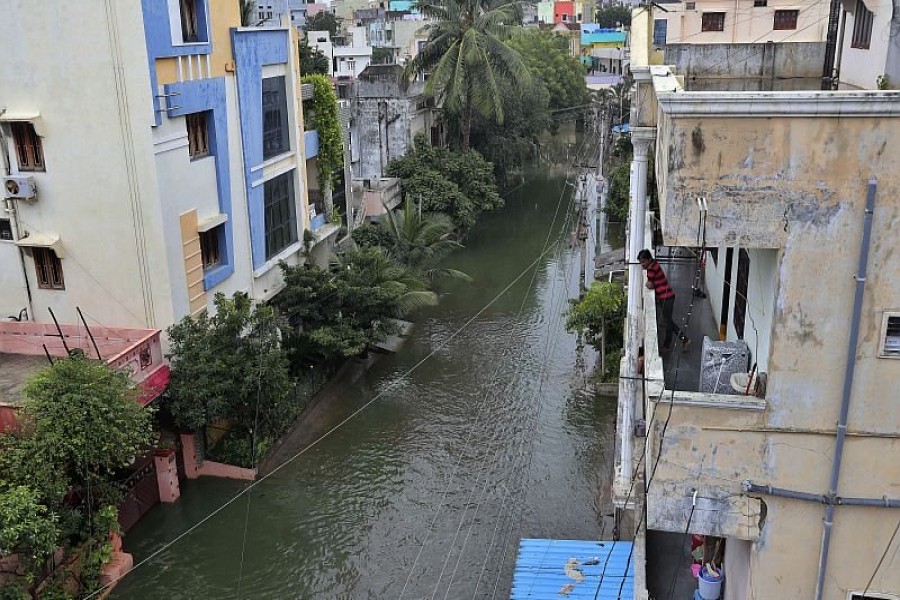 A resident looks at a street inundated with floodwaters after heavy rainfall in Hyderabad – AP photo