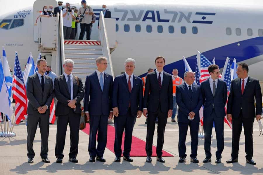 Senior US Presidential Adviser Jared Kushner and US National Security Adviser Robert O'Brien pose with members of the Israeli-American delegation in front of the El Al's flight LY971, which will carry the delegation from Tel Aviv to Abu Dhabi at Ben Gurion Airport, near Tel Aviv, Israel on Monday –Reuters Photo