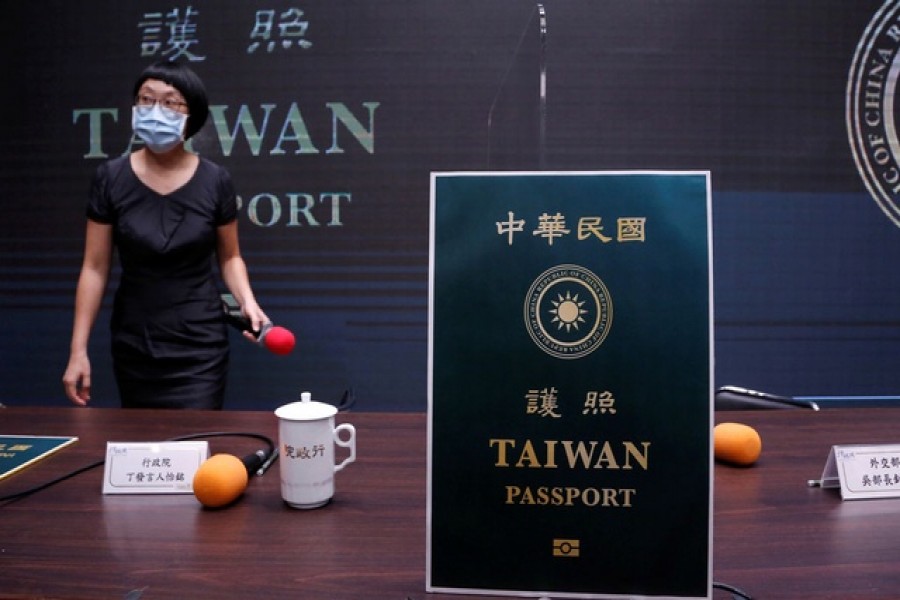 A paper cut out of the new Taiwan passport is displayed in Taipei, Taiwan, September 02, 2020. REUTERS