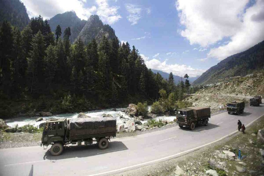 An Indian army convoy moves on the Srinagar- Ladakh highway at Gagangeer, northeast of Srinagar, Indian-controlled Kashmir. AP Photo