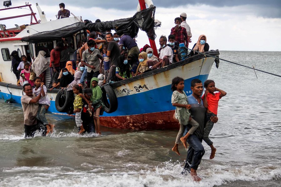 Rohingya refugees are evacuated by locals at a coast of North Aceh, Indonesia on June 25, 2020 in this photo taken by Antara Foto — via Reuters/Files