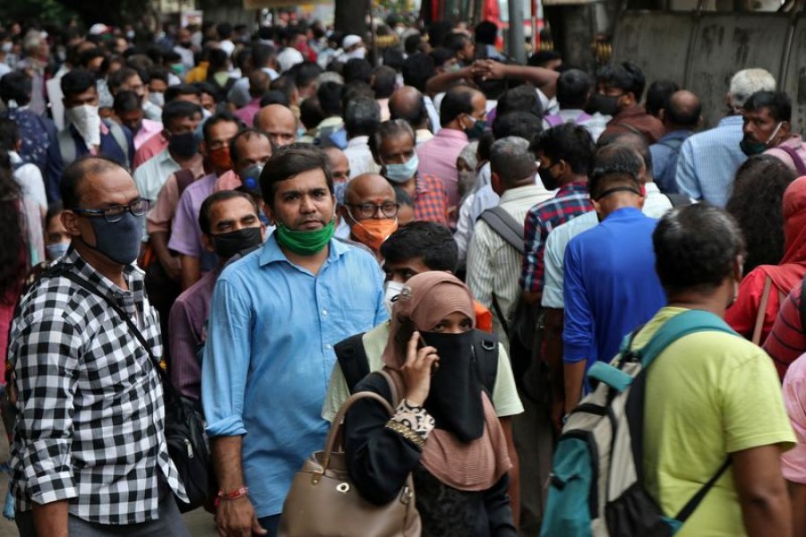 People wait to board passenger buses during rush hour at a bus terminal, amidst the coronavirus disease (Covid-19) outbreak, in Mumbai, India on September 9, 2020 — Reuters photo