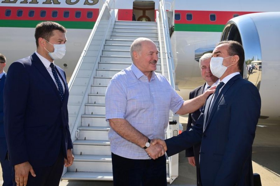 Belarusian President Alexander Lukashenko greets officials during a welcoming ceremony upon his arrival at an airport in Sochi, Russia on September 14, 2020 — Andrei Stasevich/BelTA/Handout via REUTERS