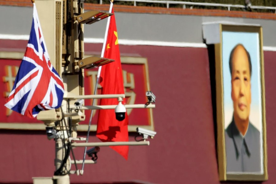 A Union flag and a Chinese flag are placed at a pole with security cameras in front of a portrait of late Chinese Chairman Mao Zedong at the Tiananmen gate during a visit by the then British Prime Minister Theresa May to China, in Beijing on January 31, 2018 — Reuters/Files