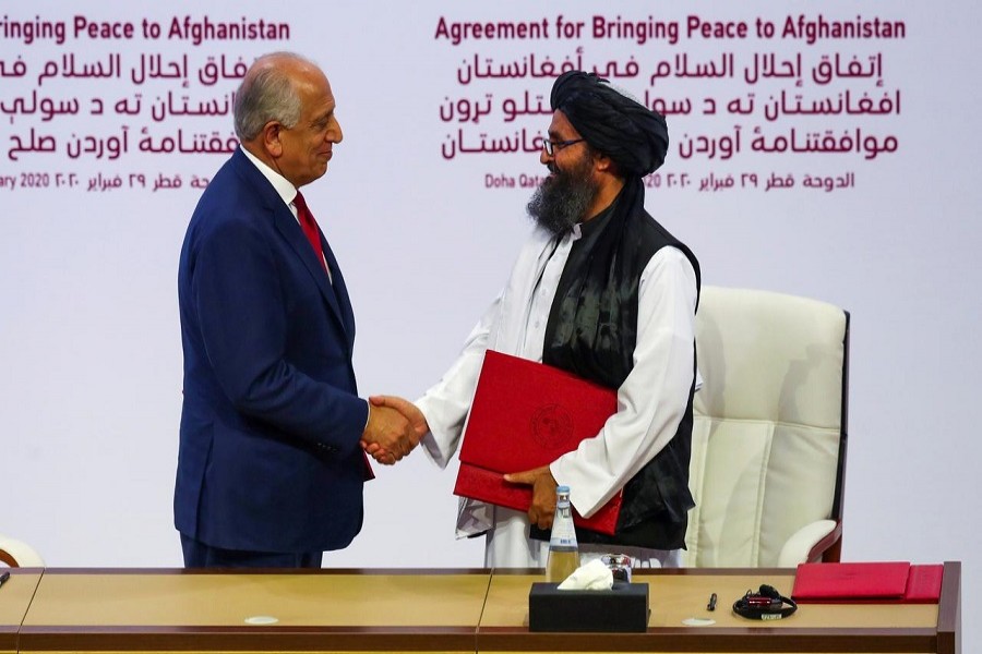 Mullah Abdul Ghani Baradar, the leader of the Taliban delegation, and Zalmay Khalilzad, US envoy for peace in Afghanistan, shake hands after signing an agreement at a ceremony between members of Afghanistan's Taliban and the US in Doha, Qatar, February 29, 2020 — Reuters/Files