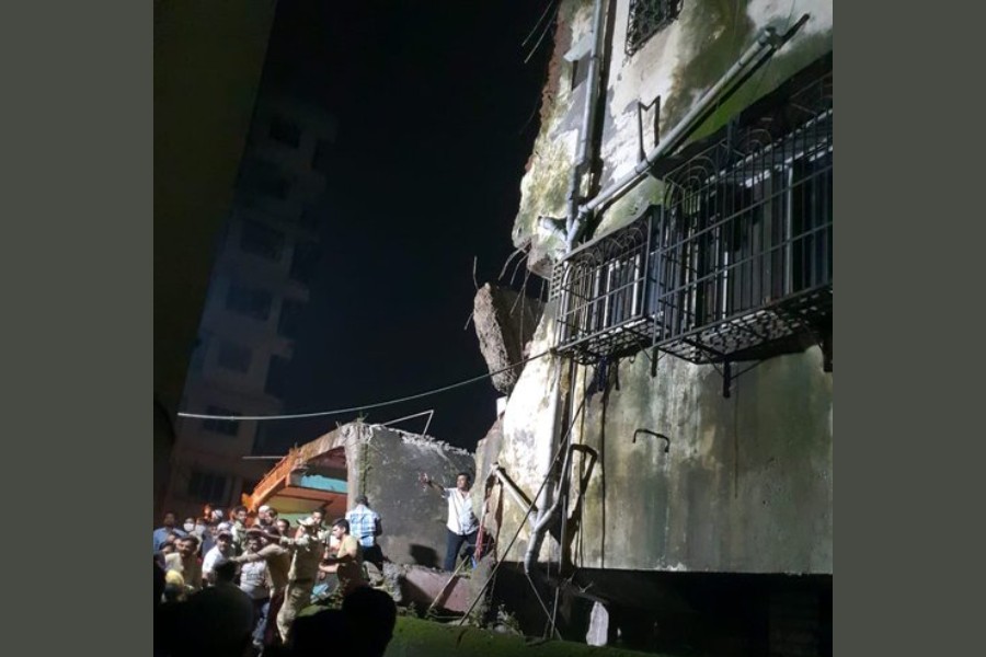 Around 20 families were reportedly staying inside the building which was reportedly 40 years old - photo collected from Twitter