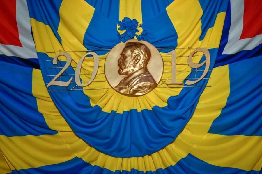 The flags of Sweden and Norway draped around a copy of the Nobel Prize medal at the Nobel award ceremony are pictured at Stockholm Concert Hall, in Stockholm, Sweden on December 10, 2019