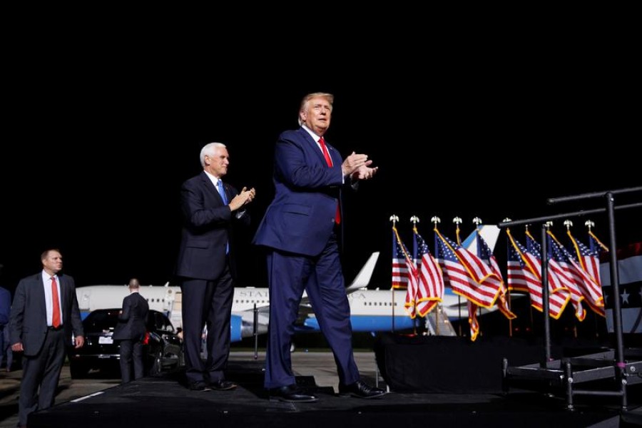 US President Donald Trump accompanied by Vice President Mike Pence arrives at a campaign rally in Newport News, Virginia, US, September 25, 2020 — Reuters