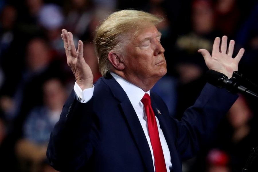 President Donald Trump reacts during a campaign rally in Battle Creek, Michigan, December 18, 2019, on the day the House of Representatives voted to impeach him — Reuters/Files