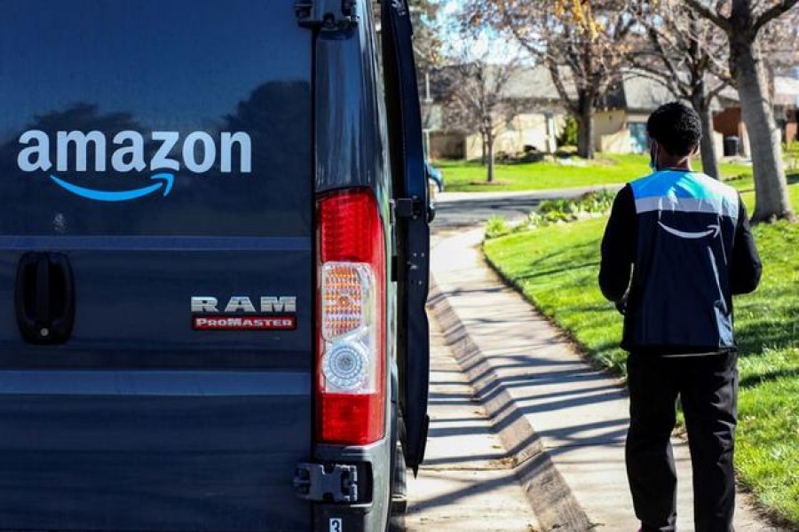 An Amazon worker delivers packages amid the coronavirus disease (Covid-19) outbreak in Denver, Colorado, US. Picture taken on April 22, 2020 — Reuters/Files