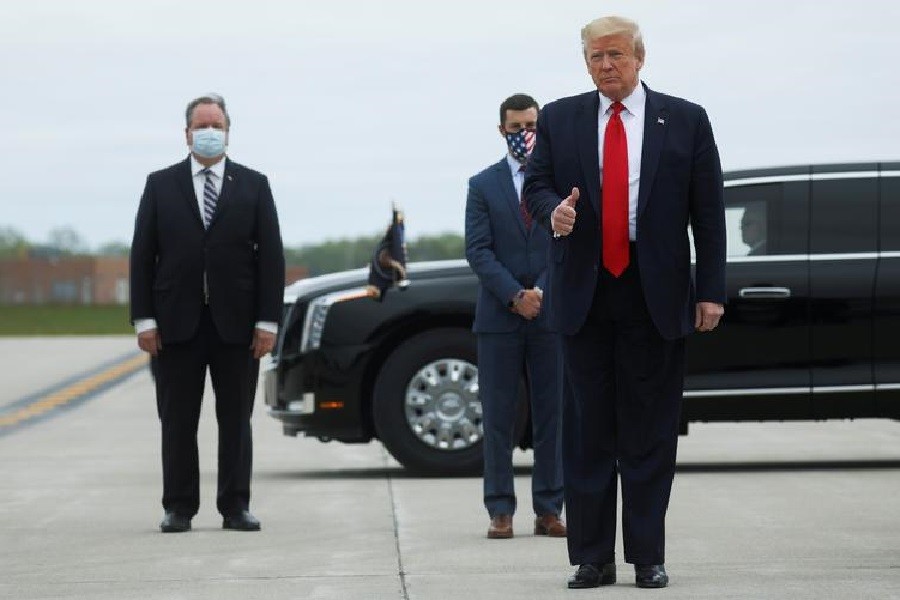 US President Donald Trump is greeted on the tarmac at Detroit International Airport by Plymouth, Michigan Township Supervisor Kurt Heise and Michigan House of Representatives Speaker Lee Chatfield as he heads to visit the Ford Rawsonville Components Plant in Ypsilanti during the coronavirus disease (Covid-19) pandemic after arriving in Detroit, Michigan, US, May 21, 2020 — Reuters/Files