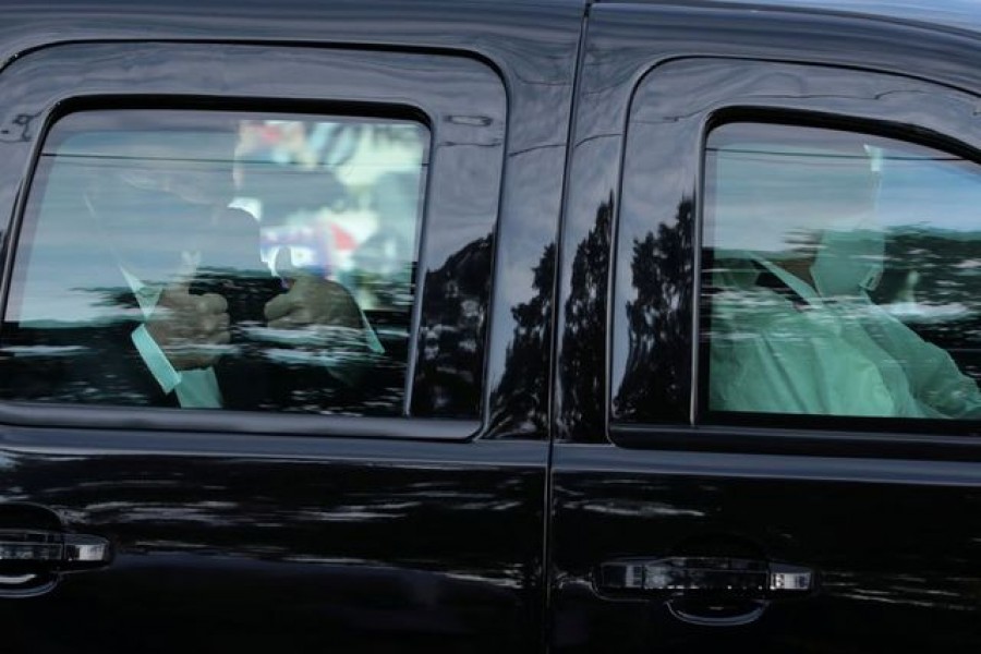 US President Donald Trump rides in front of the Walter Reed National Military Medical Center, where he is being treated for the coronavirus disease (Covid-19) in Bethesda, Maryland, US on October 4, 2020 — Reuters photo