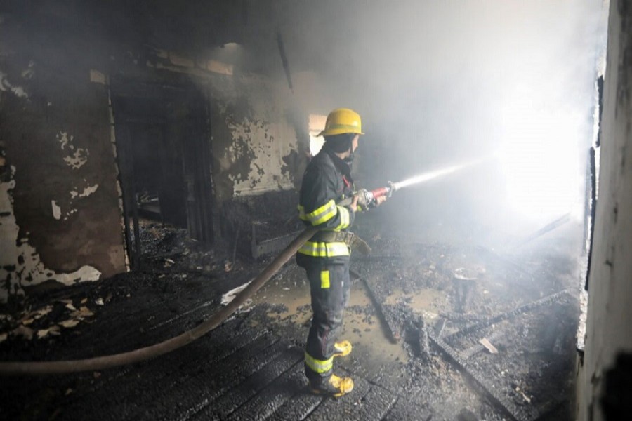 A firefighter extinguishes a fire in a house caused by shelling in the fighting over the breakaway region of Nagorno-Karabakh in the town of Barda, Azerbaijan, October 5, 2020 — Reuters