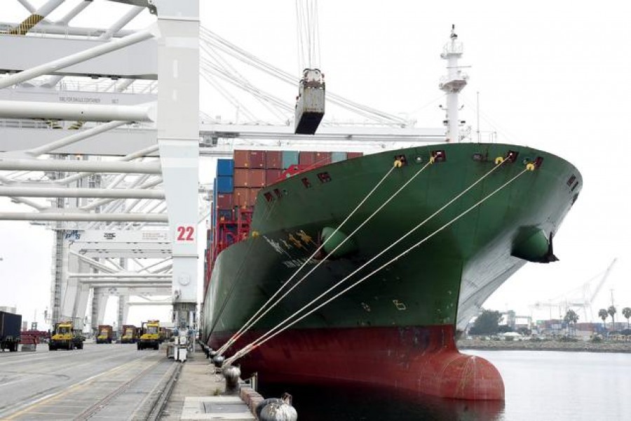 Shipping containers are being loaded onto Xin Da Yang Zhou ship from Shanghai, China at Pier J at the Port of Long Beach in Long Beach, California, US, April 4, 2018. REUTERS/Bob Riha Jr