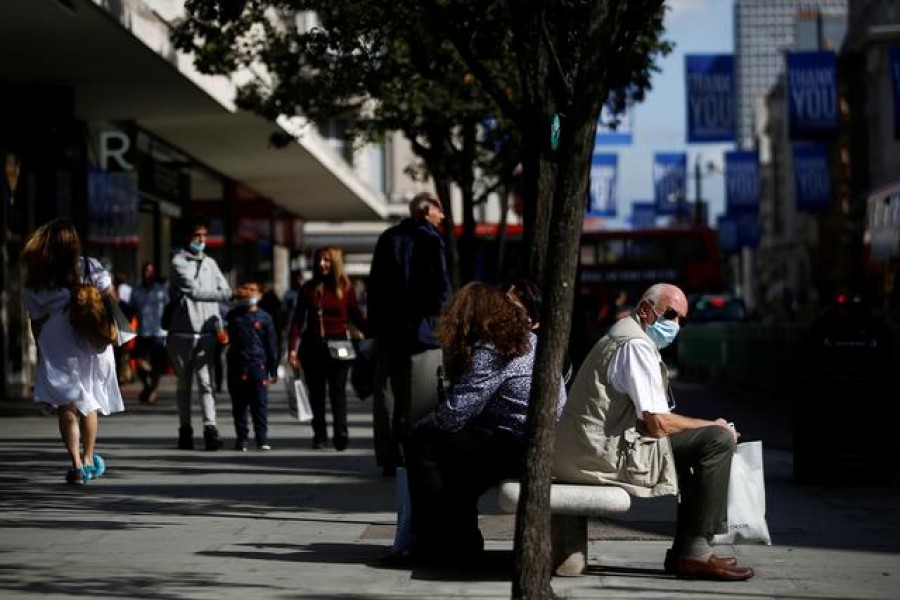 A man wearing a protective face mask sits on a bench on Oxford Street, amid the coronavirus disease (Covid-19) outbreak, in London, Britain on September 17, 2020 — Reuters/Files