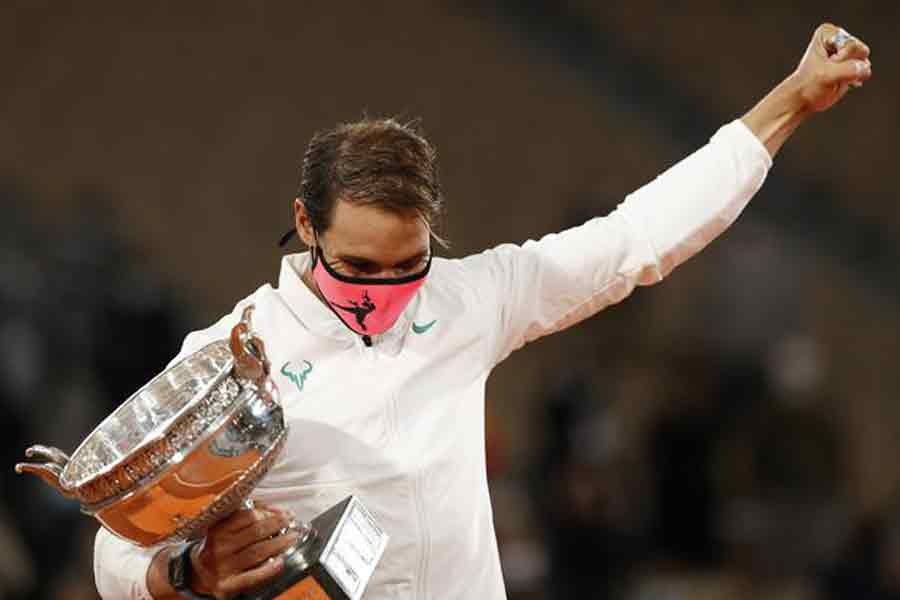 Rafael Nadal celebrating with the trophy after winning the French Open final against Serbia’s Novak Djokovic  on Sunday –Reuters Photo