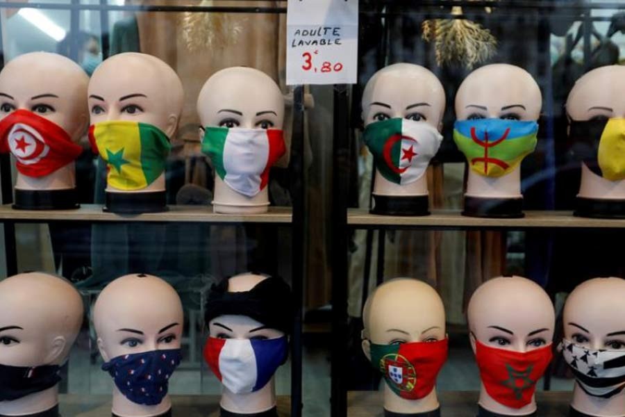 Protective face masks with flags design are seen on display in a shop in Paris, as the coronavirus disease (COVID-19) outbreak continues in France. The photo was taken on Tuesday. –Reuters Photo