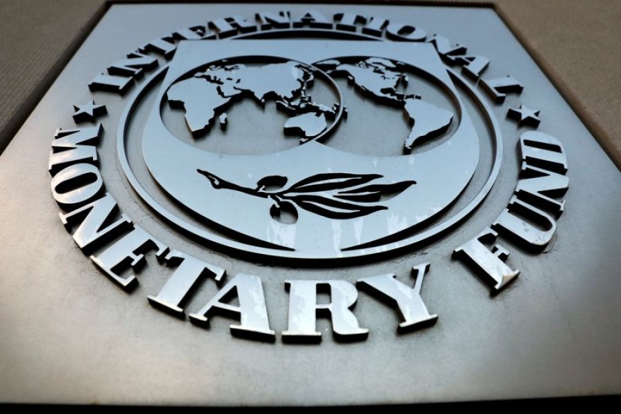 FILE PHOTO: The International Monetary Fund (IMF) logo is seen outside the headquarters building in Washington, US, September 4, 2018. REUTERS/Yuri Gripas