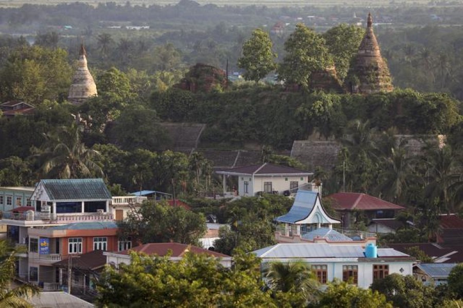 A landscape view of the downtown with ancient pagodas in the background in Mrauk U, Rakhine state, Myanmar June 28, 2019. REUTERS/Ann Wang/File Photo