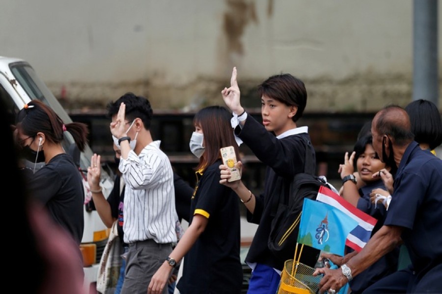 A student shows a three-finger salute in Bangkok, Thailand October 21, 2020. REUTERS