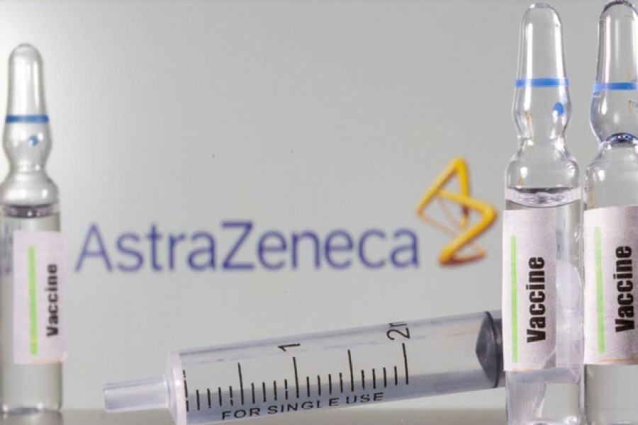 A test tube labelled vaccine is seen in front of AstraZeneca logo in this illustration taken, September 9, 2020 — Reuters/Files