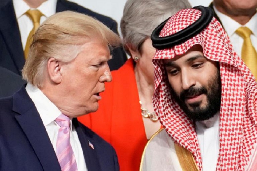 US President Donald Trump speaks with Saudi Arabia's Crown Prince Mohammed bin Salman during family photo session with other leaders and attendees at the G20 leaders summit in Osaka, Japan, June 28, 2019 — Reuters/Files