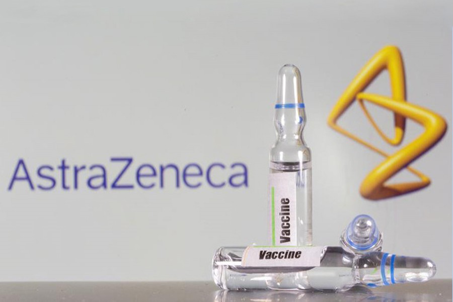 A test tube labelled with the vaccine is seen in front of AstraZeneca logo in this illustration taken on September 9, 2020 — Reuters/Files