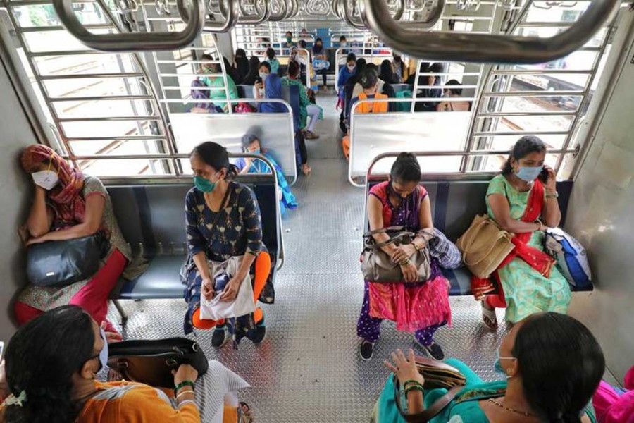 Women wearing protective face masks commute in a suburban train after authorities resumed the train services for women passengers during non-peak hours, amidst the coronavirus disease (Covid-19) outbreak, in Mumbai, India on October 21, 2020 — Reuters photo