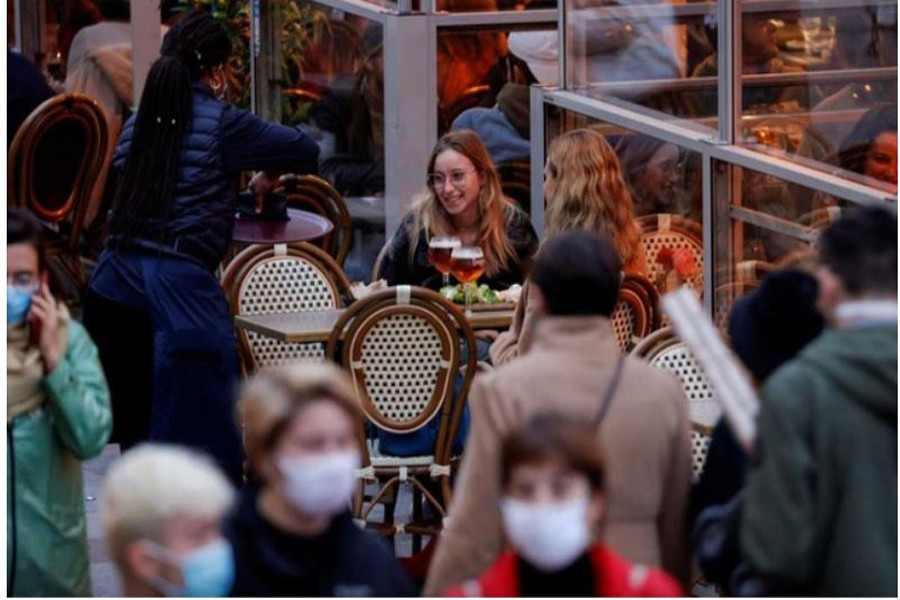 People sit at bar terraces and enjoy their beers before the late-night curfew due to restrictions against the spread of the coronavirus disease (COVID-19) in Lille, France, Oct 16, 2020. REUTERS