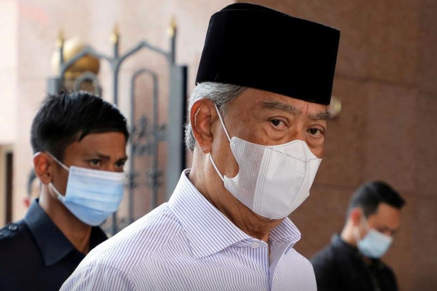 Malaysia's Prime Minister Muhyiddin Yassin wearing a protective mask arrives at a mosque for prayers, amid the coronavirus disease (COVID-19) outbreak in Putrajaya, Malaysia August 28, 2020. REUTERS/Lim Huey Teng/File Photo/File Photo