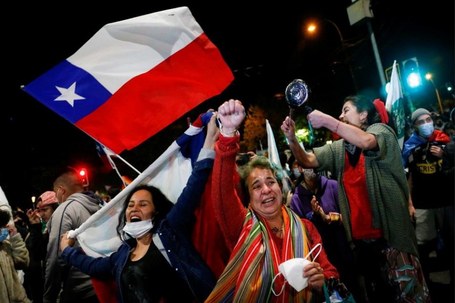 Supporters of the "I Approve" option react after hearing the results of the referendum on a new Chilean constitution in Valparaiso, Chile, October 25, 2020. REUTERS/Rodrigo Garrido