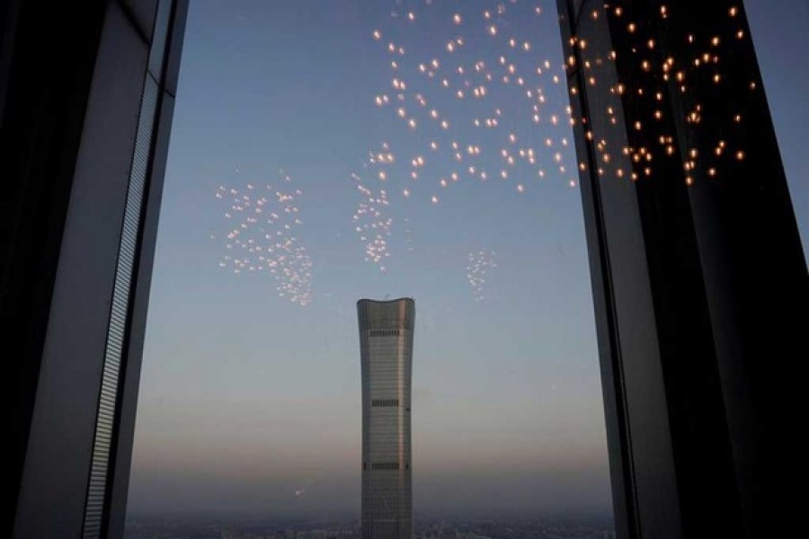 China Zun Tower under construction is seen through a window in Beijing's central business area, China, November 21, 2018 — Reuters/Files