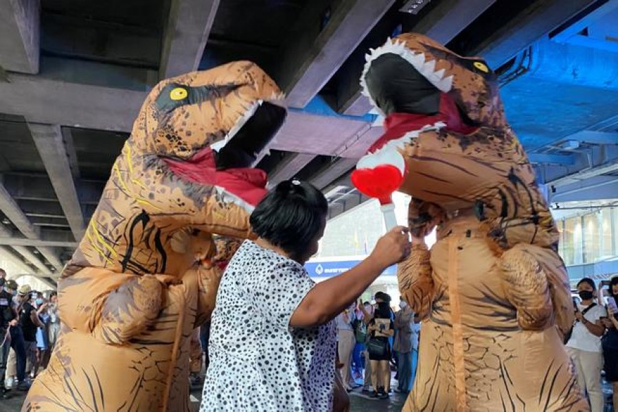 Dinosaur costumed actors representing Thailand's establishment at a high school student led protest in Bangkok, Thailand November 21, 2020. REUTERS/Matthew Tostevin