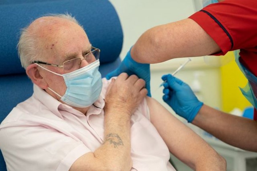 George Dyer, 90, receives the first Pfizer/BioNTech Covid-19 vaccine, administered by General manager of Covid Recovery Becky Board, at Croydon's University Hospital, on the first day of the largest immunisation programme in the British history, in London, Britain on December 8, 2020 — Reuters photo