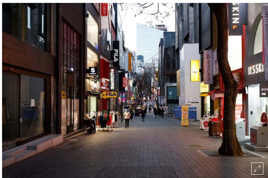 FILE PHOTO: A previously crowded shopping street affected by heightened social distancing rules is pictured amid the coronavirus disease (COVID-19) pandemic in Seoul, December 8, 2020. REUTERS/Kim Hong-Ji
