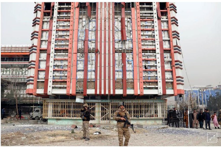 Afghan security forces inspect in front of a damaged building at the site of a blast in Kabul, Afghanistan December 20, 2020. REUTERS/Mohammad Ismail