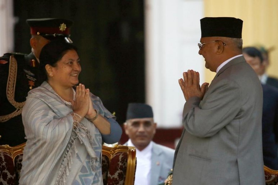 Newly elected Nepalese President Bidhya Devi Bhandari greets Prime Minister Khadga Prasad Sharma Oli, also known as K.P. Oli, after taking an oath of office at the presidential building Shital Niwas in Kathmandu, Nepal, March 14, 2018. Reuters