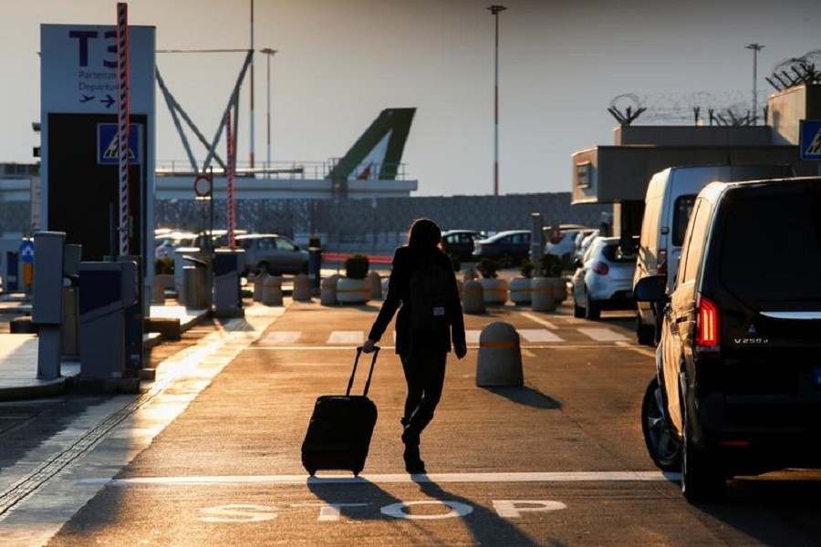 A passenger walks at Fiumicino airport after the Italian government announced all flights to and from the UK will be suspended over fears of a new strain of the coronavirus, amid the spread of the coronavirus disease (Covid-19), in Rome, Italy, December 20, 2020 — Reuters